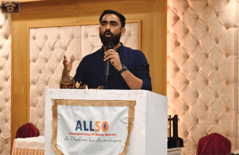 Kamlesh Pandya speaking at an event
