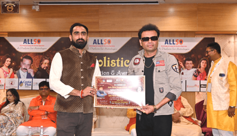 Kamlesh Pandya receiving an award